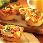Baked Eggs and Sausages in Toast Cups