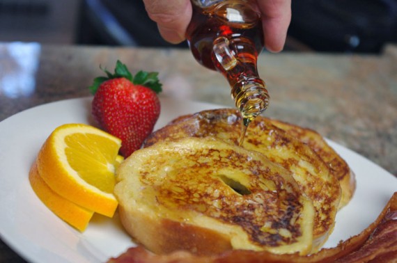 Pouring Syrup On French Toast