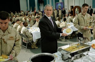 President George W. Bush showing off a pancake