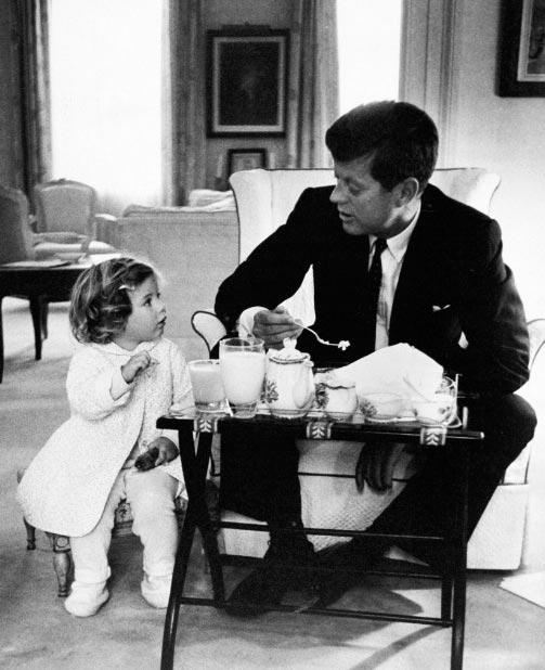 President John F. Kennedy Having Breakfast With Daughter