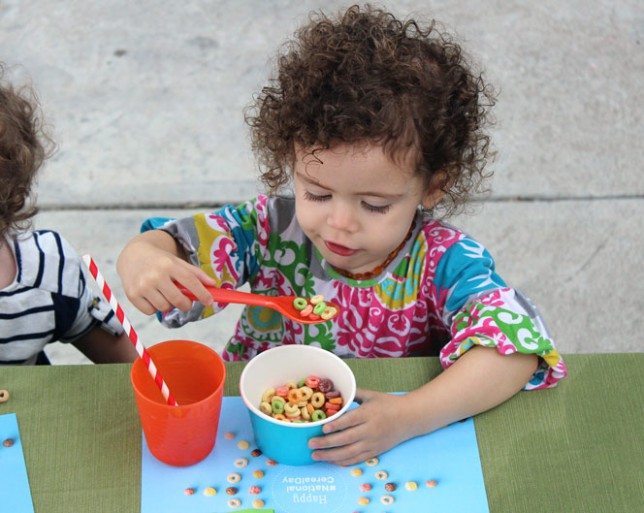 Cute Kid Eating Fruity Cheerios