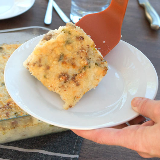 Transferring Grits And Sausage Casserole To A Plate