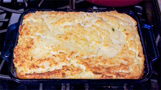 Vegetarian Cheesy Baked Grits in casserole dish