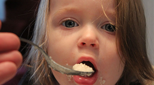 A Baby Eats Cinnamon Grits