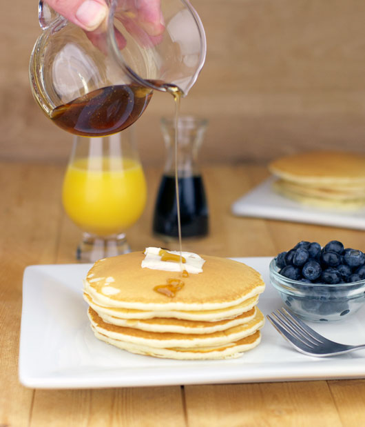 Pouring Syrup On Basic Buttermilk Pancakes