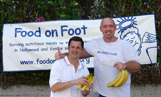 Mr Breakfast presents a check for 1,111 bananas to Food On Foot founder Jay Goldinger